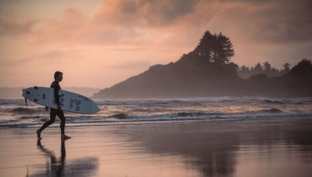 A surfer on Cox Bay