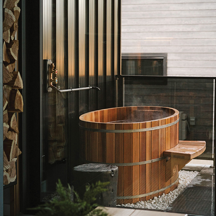 Patio ofuro tubs are the main draw of the Woodland Cabins