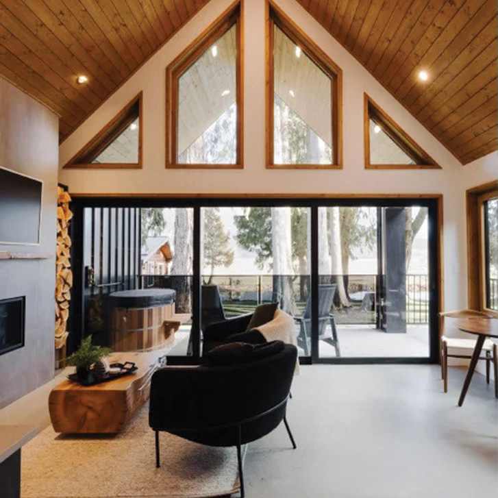The interior of the cabin has a modern, minimalist vibe: it’s all concrete, black, white and wood.