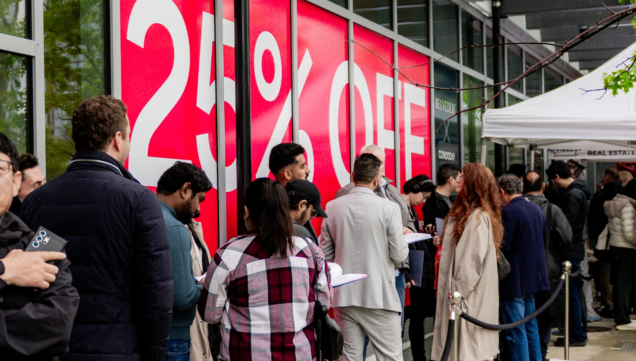Buyers queued up in front of red flash condo sale sign