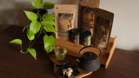 arrangement of Tsuen tea products on a wooden table